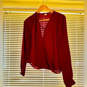 Red, low cut flowy blouse